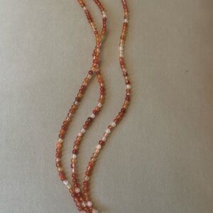 Elegant Beaded strands in Warm Orange Tones